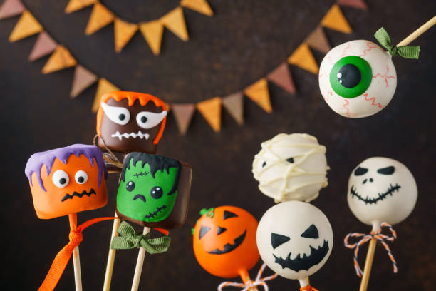 istock Halloween cake pops and chocolate marshmallows with funny faces. 1161362579