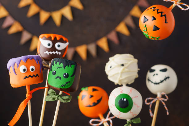 istock Halloween party with sweet cake pops monsters 1161362774