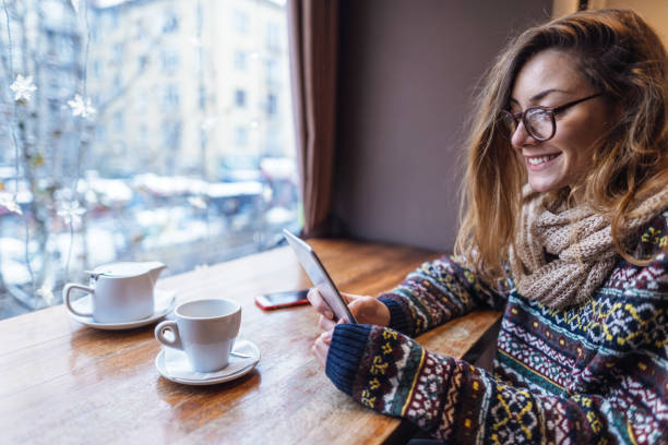 Woman reading e-book at the teashop