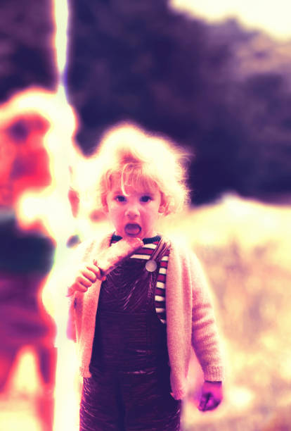 Cute blonde danish 4 year old girl looking into distance