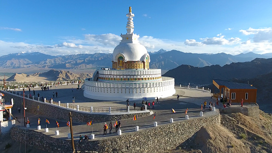 Leh , India - Jul 11 2019: Shanti Stupa is a Buddhist white-domed stupa on a hilltop in Chanspa, Leh district, Ladakh, in the north Indian state of Jammu and Kashmir.