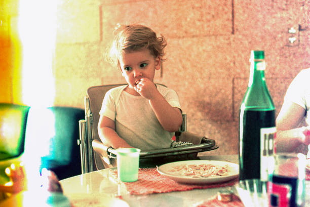 istock Vintage kid eating at home 1161365630