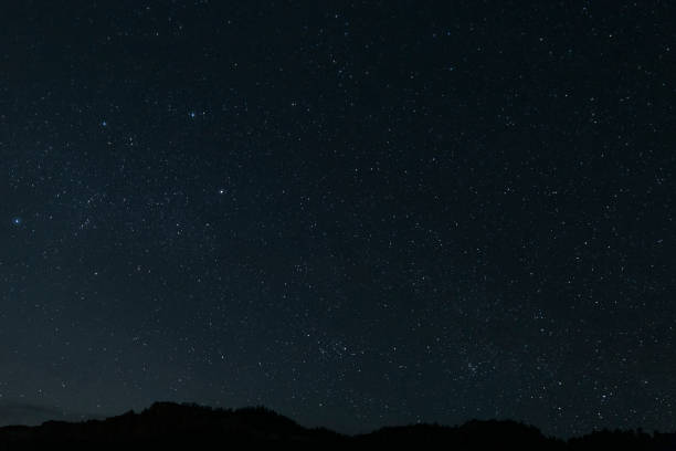 istock Starry Night Sky with Utah Mountains Silhouette 1161366396