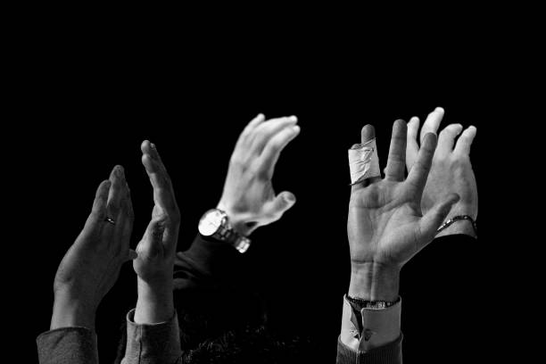 istock stop halt raised hands in black and white 1161366634