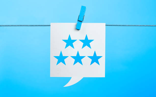 istock White Feedback concept 5 stars shape Chat Bubble Hanging On Blue Background 1161366969