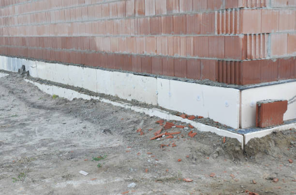 istock Close up on house foundation insulation with styrofoam sheets for home energy saving. 1161369770