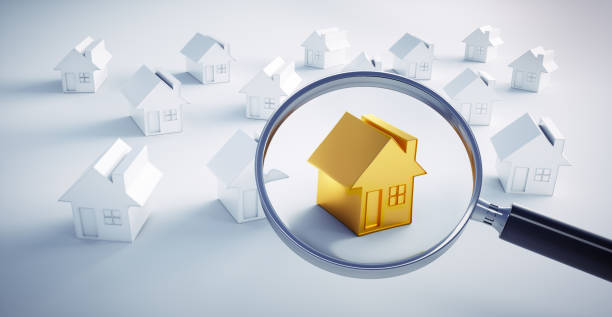 istock Golden toy house with a magnifying glass 1161371617