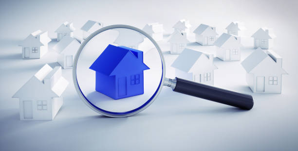 istock Blue toy house with a magnifying glass 1161371620