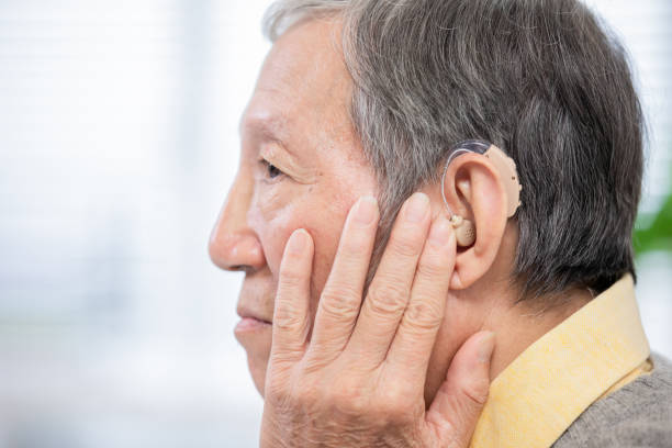 istock elder patient wear audiphone 1161371706