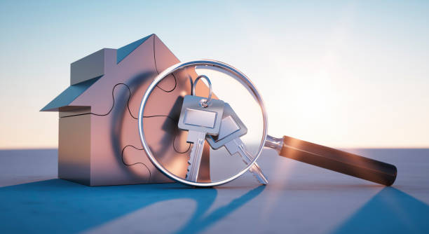 istock Golden toy house with a magnifying glass 1161371909