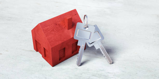 istock Red wooden toy house with keys 1161372046