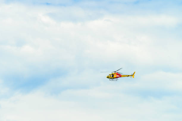 Adelaide, Australia - February 17, 2019: Westpac Lifesaver Rescue Helicopter patrolling South Australian beaches on a summer weekend