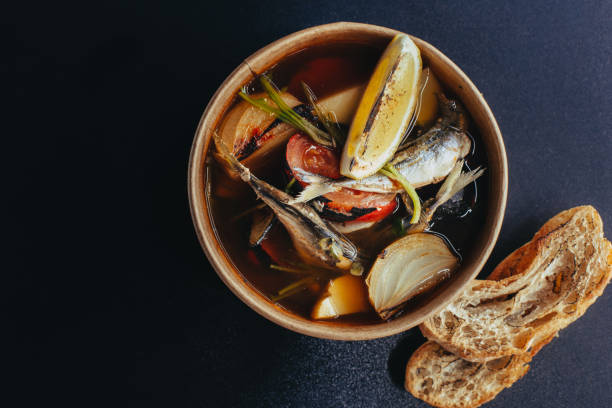 istock Fresh hot fish soup with ingredients and spices for cooking. 1161375402