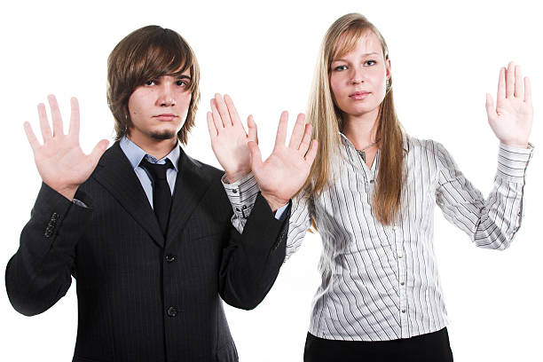 istock handsome guy and beautiful girl with hands up 116137720