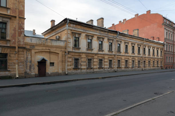 istock gloomy empty street with old houses 1161377522