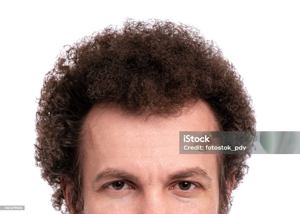 Curly hair of male head Close up cropped image of male head with Curly Hair. Man looking at camera, isolated on white background Permed Hair Stock Photo