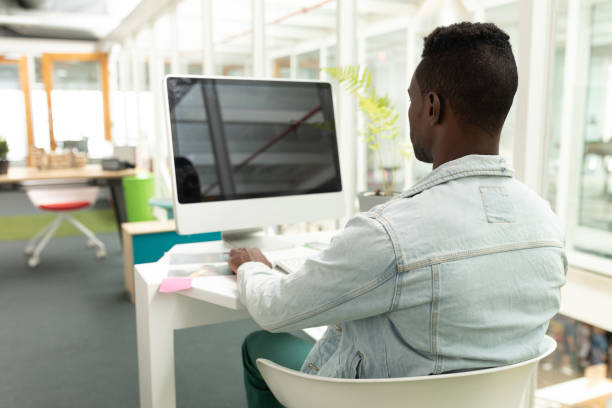 istock Male graphic designer working on computer at desk 1161383330