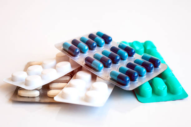 istock Pills and capsules on white background 1161383372