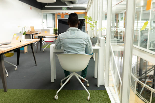 istock Male graphic designer working on computer at desk in office 1161383539