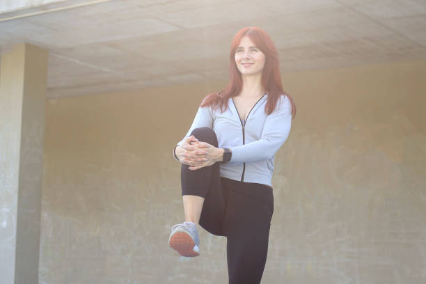 istock Young woman stretching 1161383542