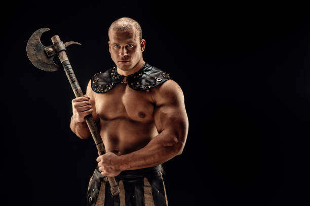istock Severe barbarian in leather costume with hammer 1161386400
