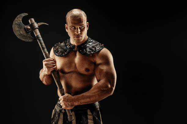 istock Severe barbarian in leather costume with hammer 1161386404