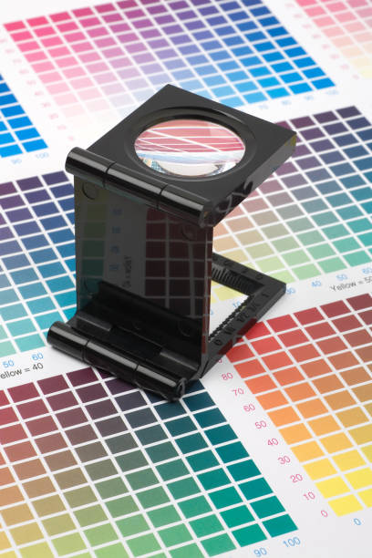 istock Glass loupe standing on colour swatch 1161386546