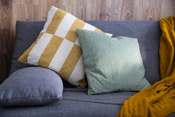 istock Homely comfort with a gray sofa and subdued light 1161387463