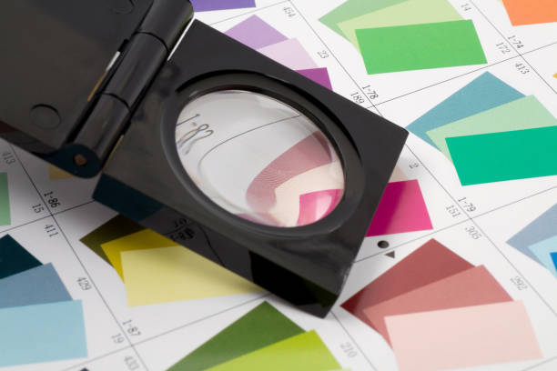 istock Glass loupe standing on colour swatch 1161387482