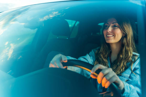 Young woman driving a car stock photo