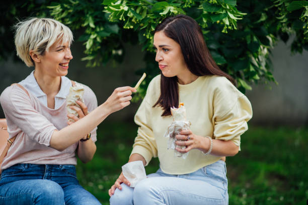 istock Girls sharing a meal 1161388976