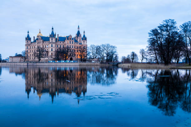 Schwerin Castle, Germany Schwerin, Germany. Schwerin Castle Palace (Schweriner Schloss), reflected on Schweriner See lake, a World Heritage Site in Mecklenburg-West Pomerania schwerin castle stock pictures, royalty-free photos & images