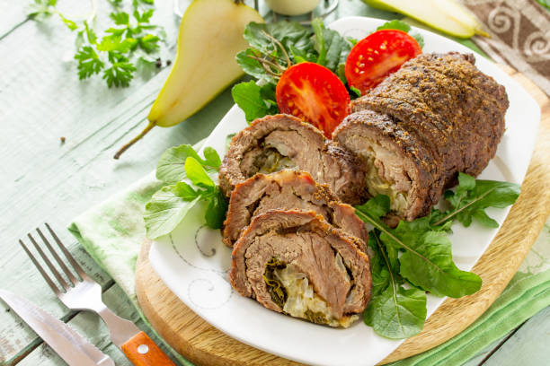 istock Stuffed Meat Roll with Pear and Cheese on a festive Thanksgiving Day table. Copy space. 1161391132