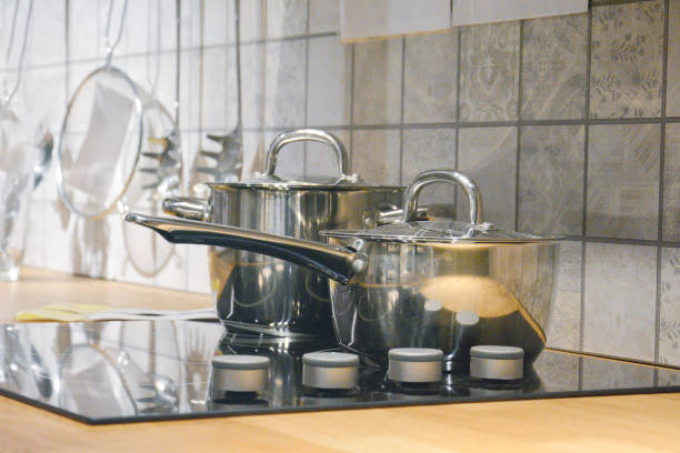 istock Kitchen Utensils On Top Wooden Counter 1161392272