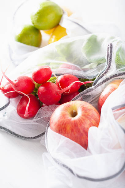 istock fruits and vegetables in reusable mesh nylon bag, plastic free zero waste concept 1161392482