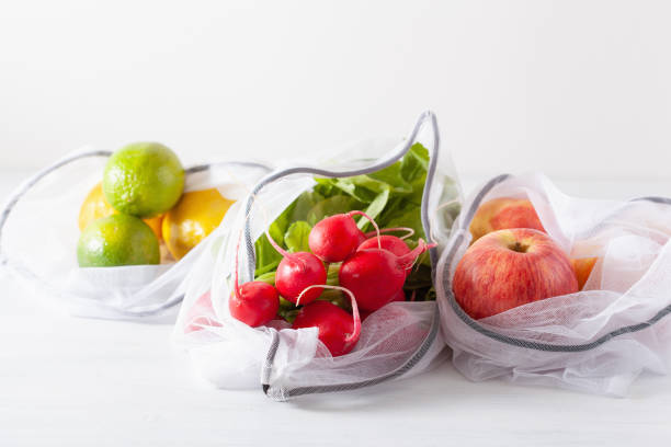 istock fruits and vegetables in reusable mesh nylon bag, plastic free zero waste concept 1161392530