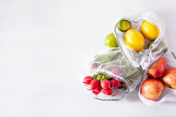 istock fruits and vegetables in reusable mesh nylon bag, plastic free zero waste concept 1161392639