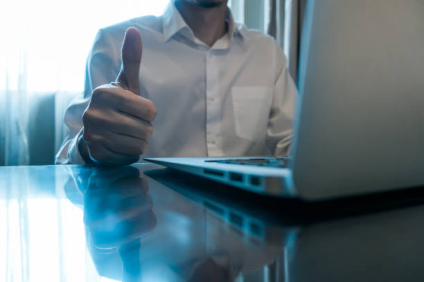 usinessman praising with thumb up