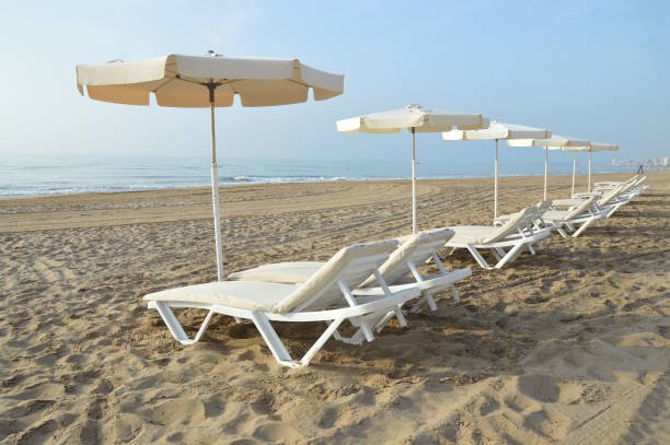 Playa Muchavista Lounge Chairs and Umbrellas stock photo