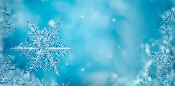 Photo of blue crystal snowflake winter background