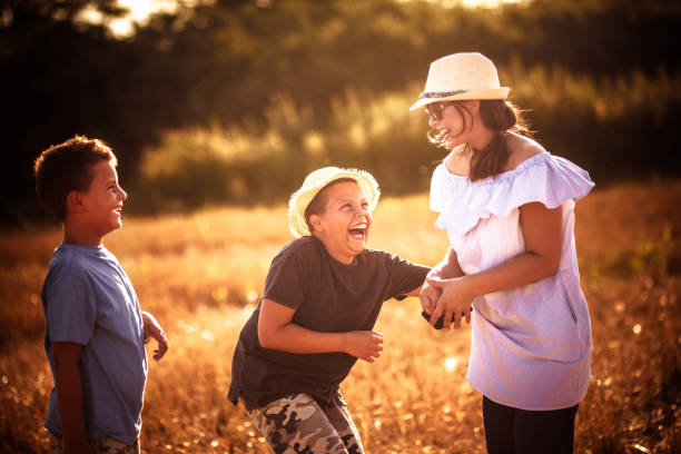 istock Mother and sons  having fun outdoors 1161403521