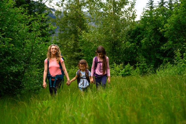 istock Mother and daughters on a mountain adventure 1161405194