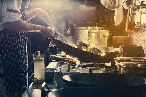istock Chef stir fry cooking 1161405251