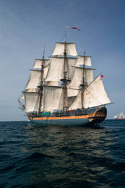 Pirate ship sailing at sea under full sail