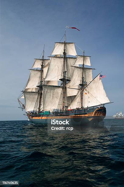 Pirate Ship Sailing At Sea Under Full Sail Stock Photo - Download Image Now - Pirate - Criminal, Portuguese Man O' War, Warship