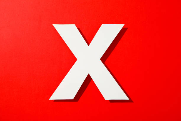 istock White letter X on color background, space for text 1161407523