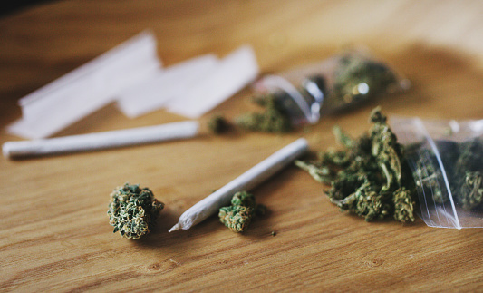 Shot of dried marijuana and a rolled joint