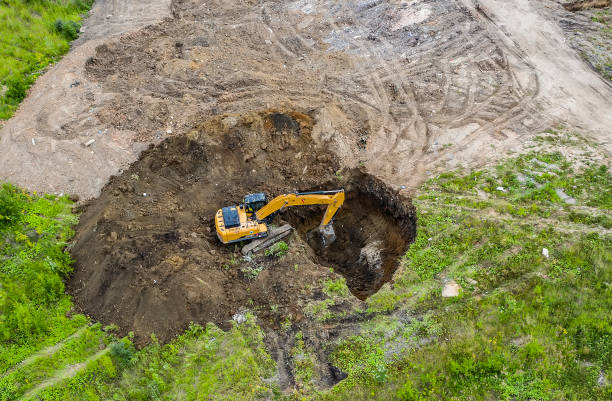 istock Aerial view of the excavator digging a large pit 1161409450