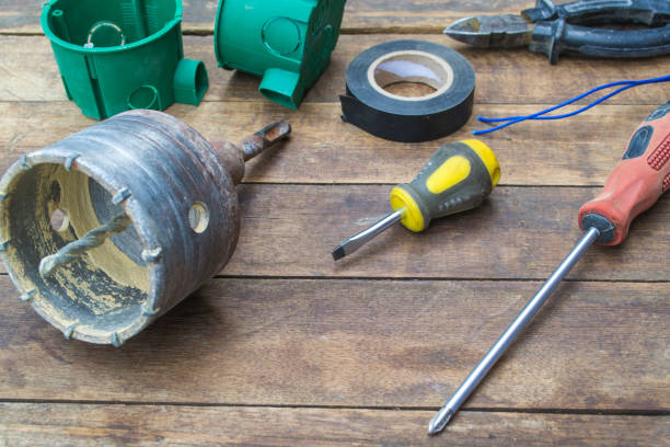 istock Electrical outlet repair tools on a wooden table. 1161411652