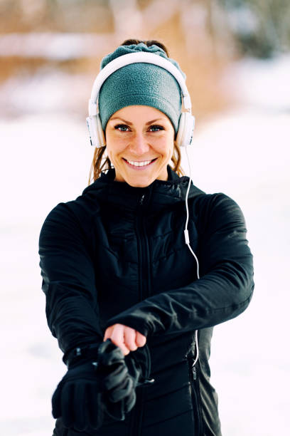 istock Female athlete jogging in park in winter 1161417824